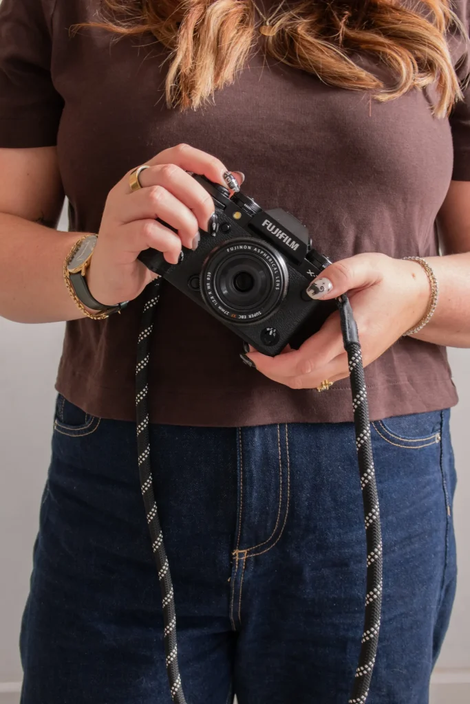 Jaye holding her Fujifilm camera